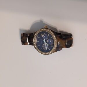 Brown and gold women’s Fossil watch